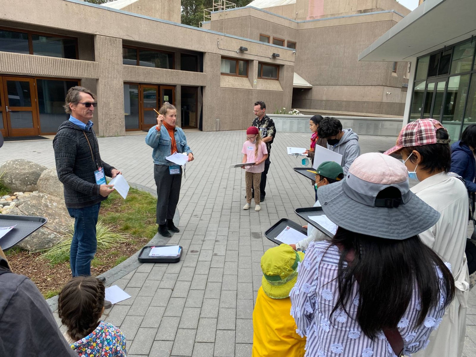 Kids and families sketching together outdoors